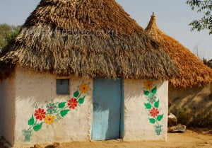 Eritrea - Hagaz, Anseba region - house decorated with floral motives - thatched roof - photo by E.Petitalot
